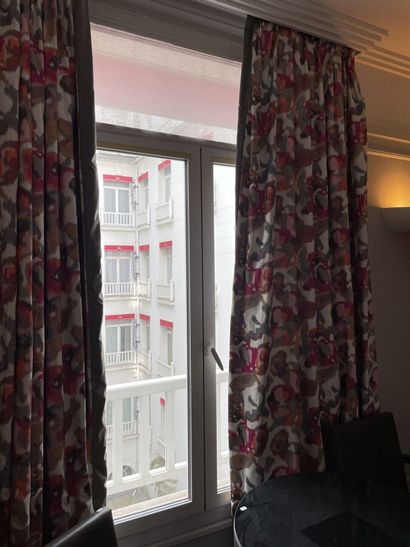 Pair of multicolored curtains with stylized...