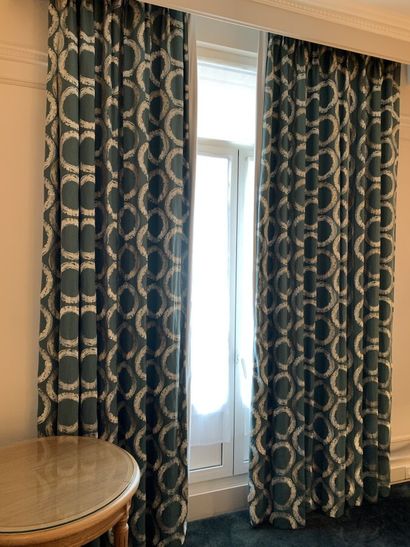 Pair of curtains lined with turquoise fabric...