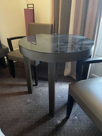 Round wooden table, black tinted mirror surface...