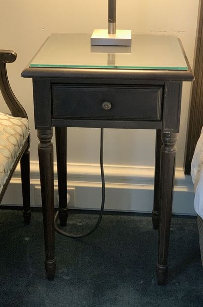 Pair of bedside tables in dark stained wood...