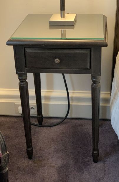 Pair of bedside tables in dark stained wood...