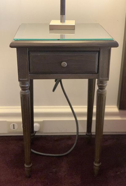 Pair of bedside tables in dark stained wood...