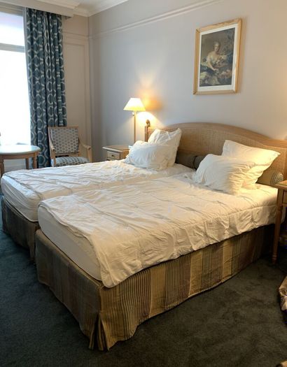 Two single beds, headboard in light natural...