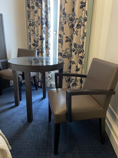 Two wooden armchairs upholstered in taupe...