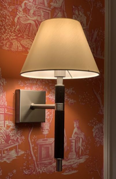 Three sconces in dark tinted wood and metal...