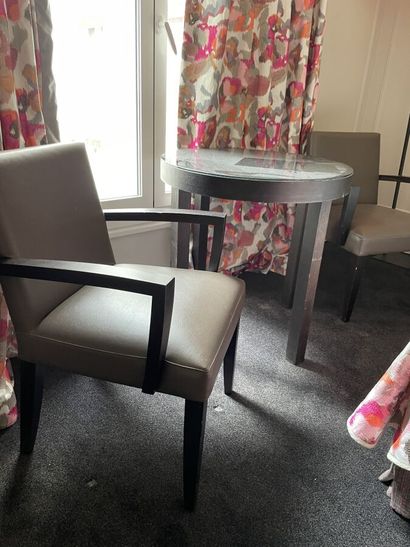 Two wooden armchairs upholstered in taupe...