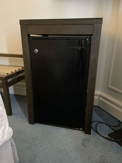 Dark wood minibar opening with a key 

88...