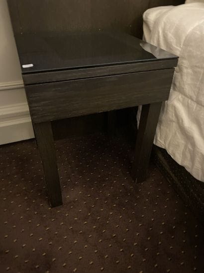 Two dark wood bedsides with a drawer and...