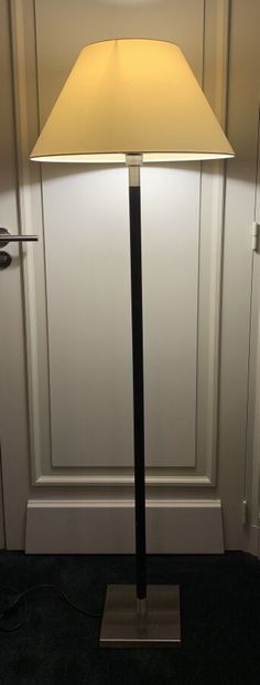 Floor lamp in dark tinted wood and metal...
