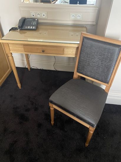Small desk in natural wood opening to a drawer,...