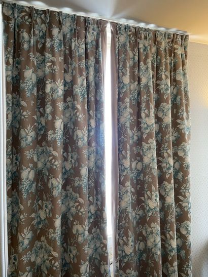 Two pairs of curtains decorated with green...