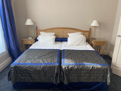Double bed composed of two box springs and...