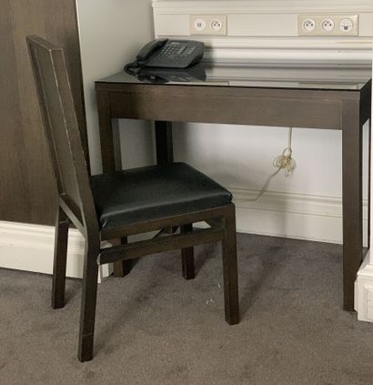 Small desk in black tinted veneer opening...