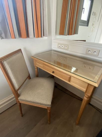 Small desk in natural wood opening on a drawer,...