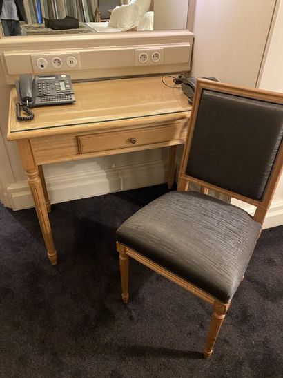 Small desk in natural wood opening on a drawer,...