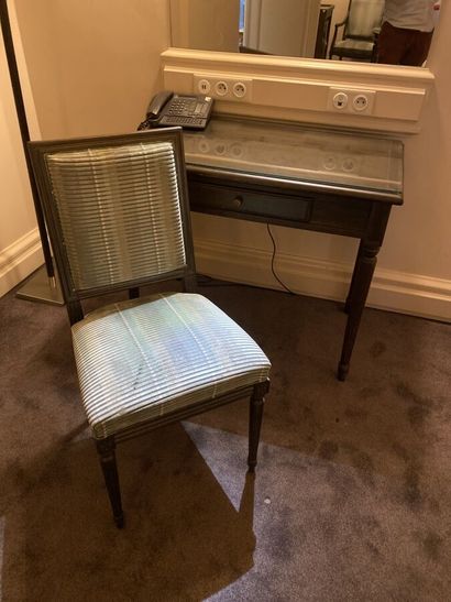 Small desk in natural wood opening to a drawer,...