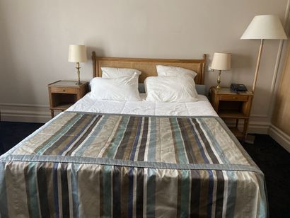 Double bed composed of a box spring and a...