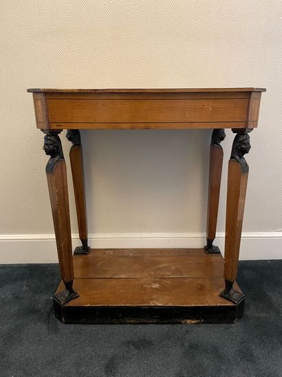 Cherry wood and blackened wood console decorated...