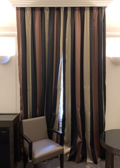Pair of curtains lined with stripes colored...