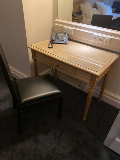 Small desk in natural wood opening on a drawer,...