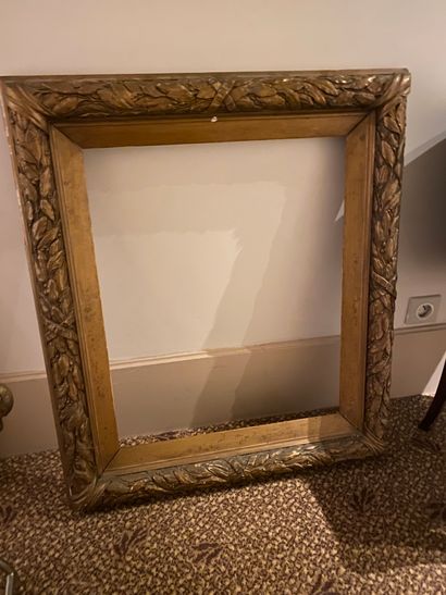 
Large wood and gilded stucco frame decorated...