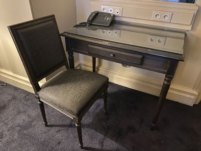 Small desk in natural wood opening on a drawer,...