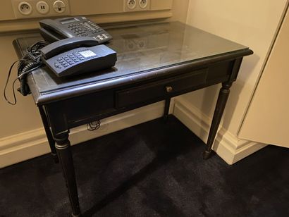 Small desk in natural wood opening on a drawer,...
