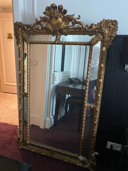 
Large wooden and stucco gilded mirror with...