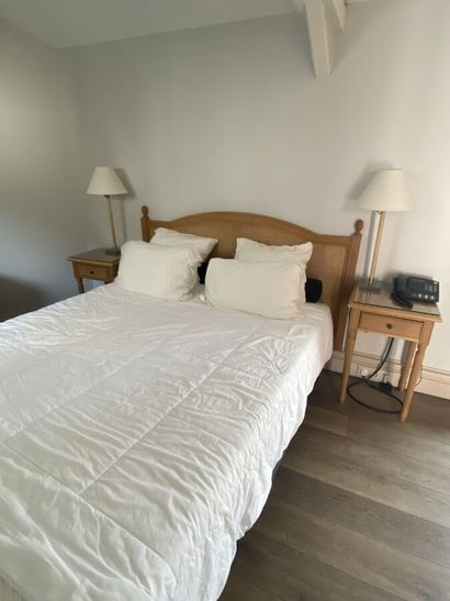 Double bed composed of a box spring and a...