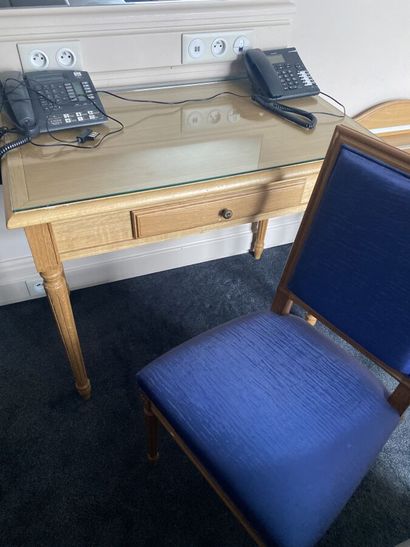 Small desk in natural wood opening to a drawer,...
