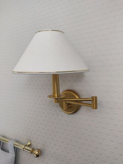 Pair of brass sconces with articulated arm...