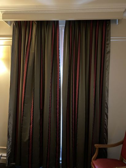 A pair of curtains in fabric with mauve and...