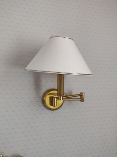 Pair of brass sconces with articulated arm...