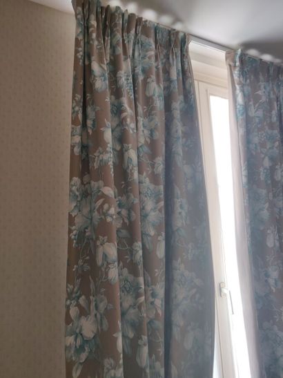 Pair of curtains with plant decoration on...