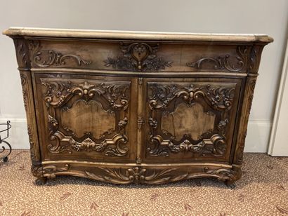 Natural wood chest of drawers opening to...