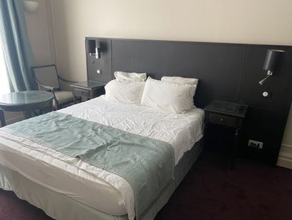 A double bed composed of a box spring and...