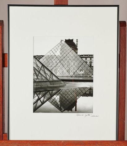A lot of framed photographs, about 20 pi...