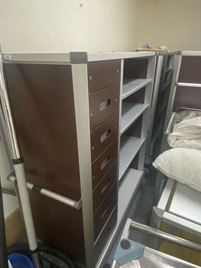 Four metal floor carts with racks and shelves...
