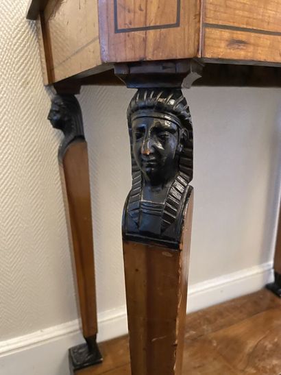 Cherry wood and blackened wood console decorated...
