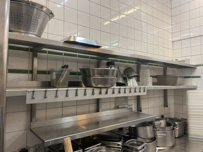 Set of stainless steel shelves on three levels...