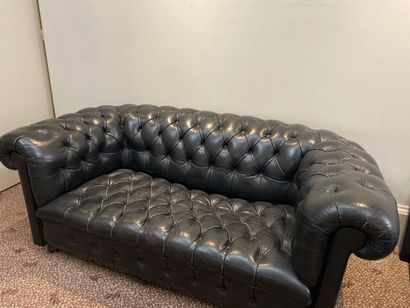 Black leather club sofa with upholstery (wear)...