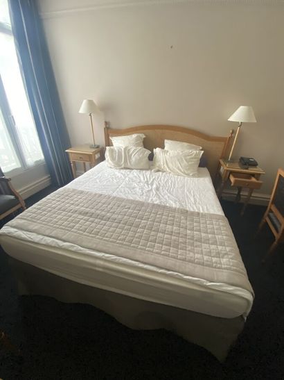 Double bed composed of a box spring and a...