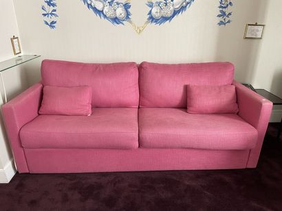 Sofa that converts into a bed, pink fabric...