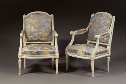 Two armchairs in molded and carved wood relacquered...
