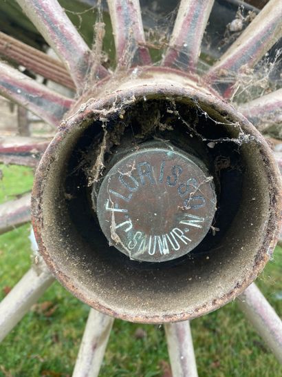 Carriage on horseback. Hub inscribed 