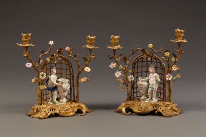 Pair of candelabras in chased and gilded...