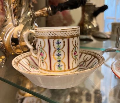 Porcelain cup with polychrome and gilded...