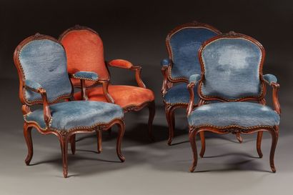 Suite of eight armchairs in molded and carved...