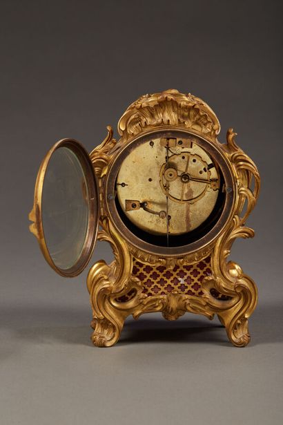 Small table clock in chased and gilded bronze...