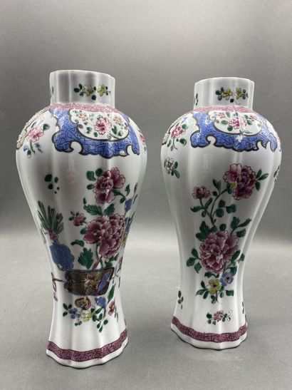 Pair of covered potiches with gadrooned sides...